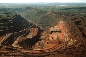 The biggest single-pit open-cut iron ore mine in the world, the BHP Biliton Mount Whaleback mine, 455 km (283 miles) south of Port Hedland is seen in this undated handout photograph obtained August 12, 2009. BHP Billiton Ltd, the world's largest miner, reported a 30 percent slide in annual profit excluding writedowns, its first fall in seven years, pummelled by a slump in metals prices and demand. REUTERS/BHP Biliton/Handout (AUSTRALIA BUSINESS ENVIRONMENT) FOR EDITORIAL USE ONLY. NOT FOR SALE FOR MARKETING OR ADVERTISING CAMPAIGNS